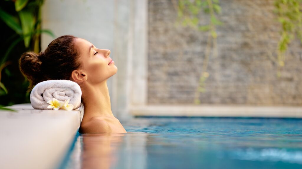 Girl relaxing in the pool at the spas
