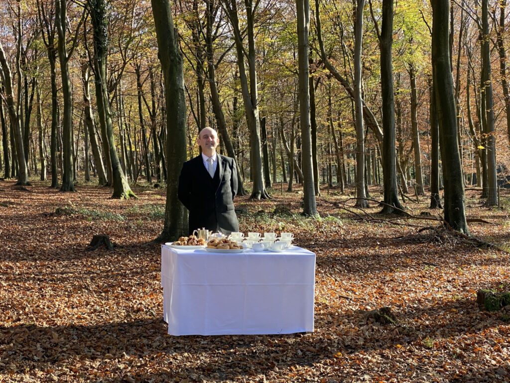 Butler with cake and coffee to help you