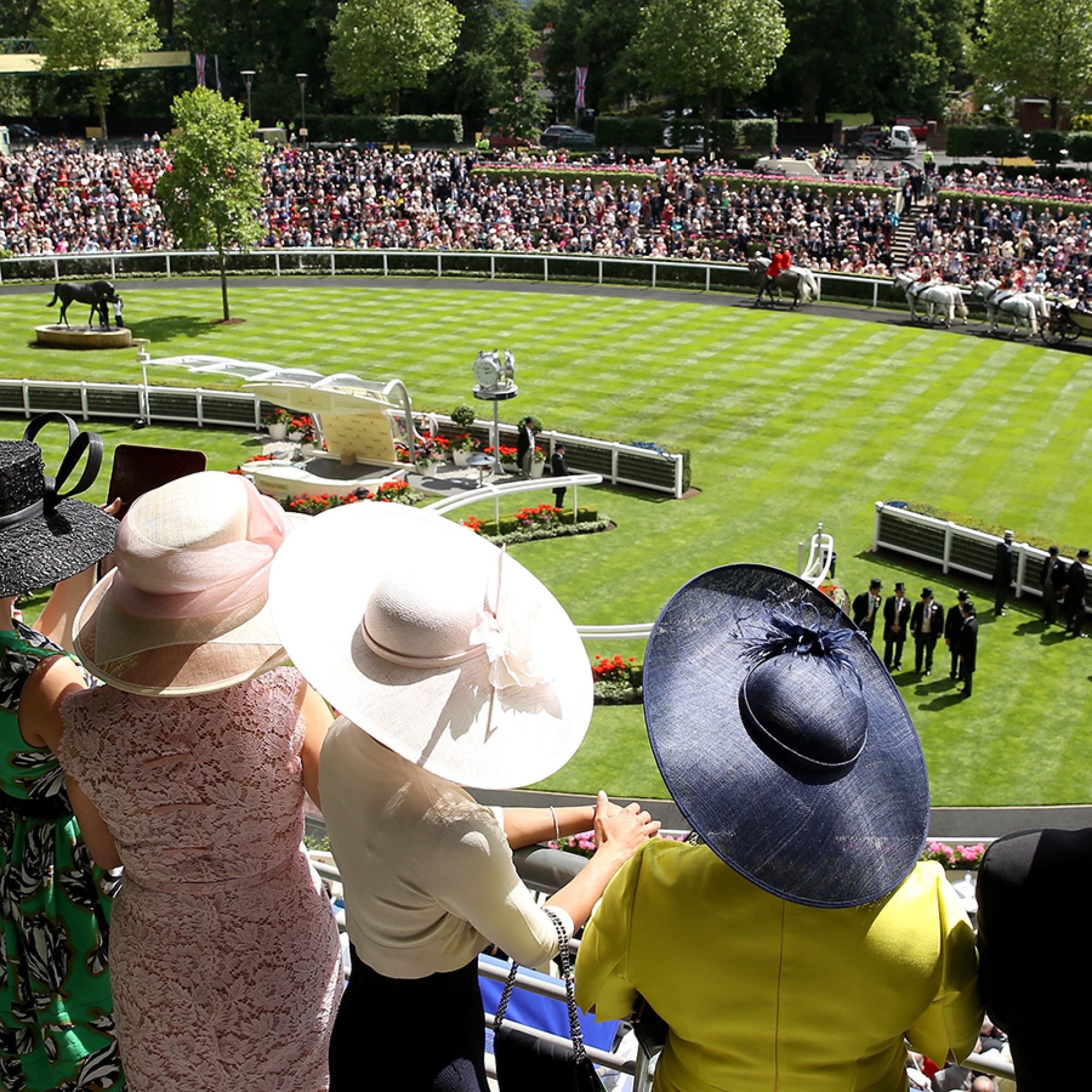Racegoers look over